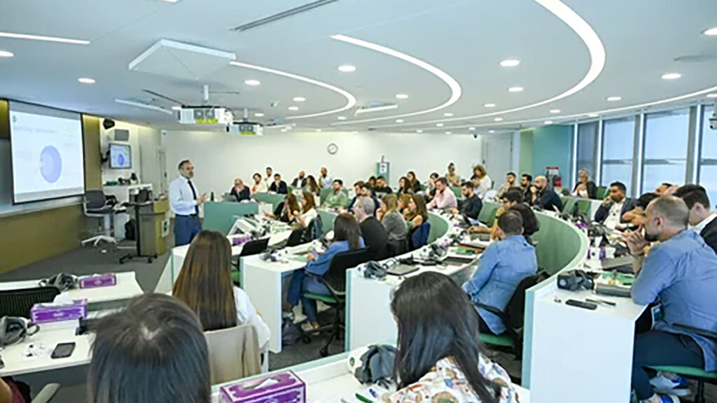 A man leading a work session to advertising and marketing leaders at ABG and INSEADs MSEI Blue Ocean Growth Strategy workshop event in Abu Dhabi